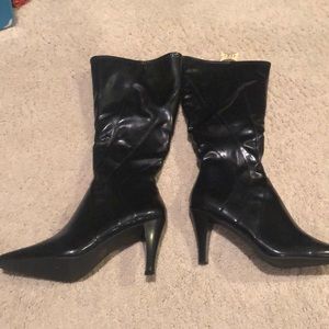 Brand new black tall zip boots. Size 7.5 women.